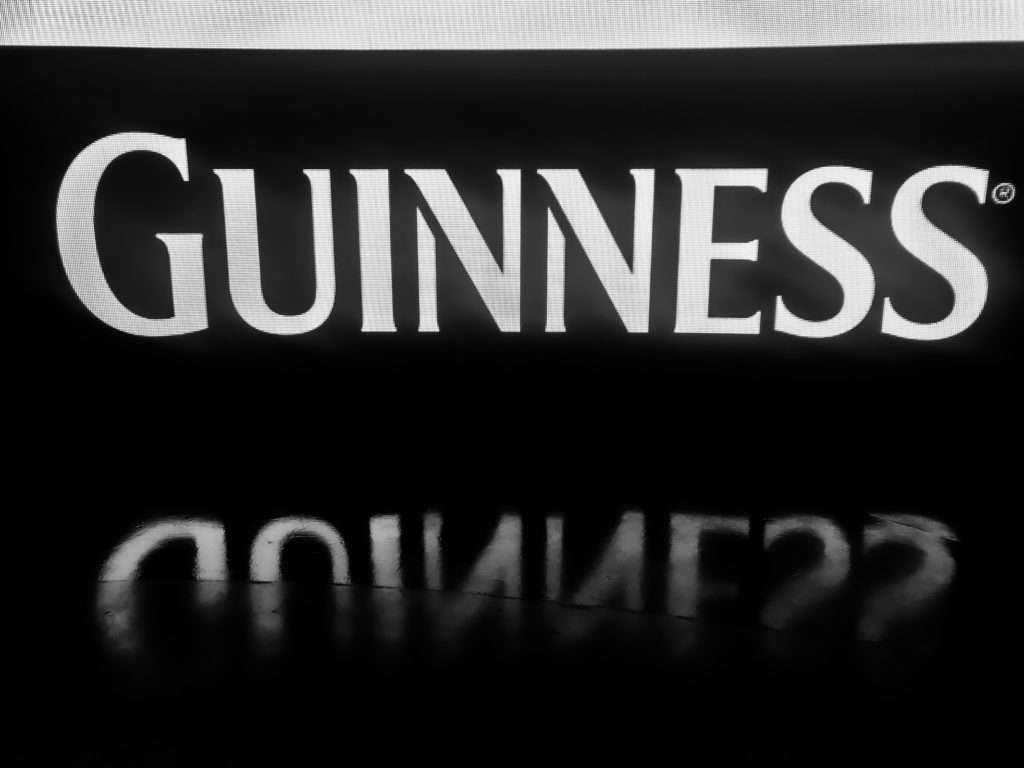 Guinness logo displayed on screen in the advertisement exhibit. 